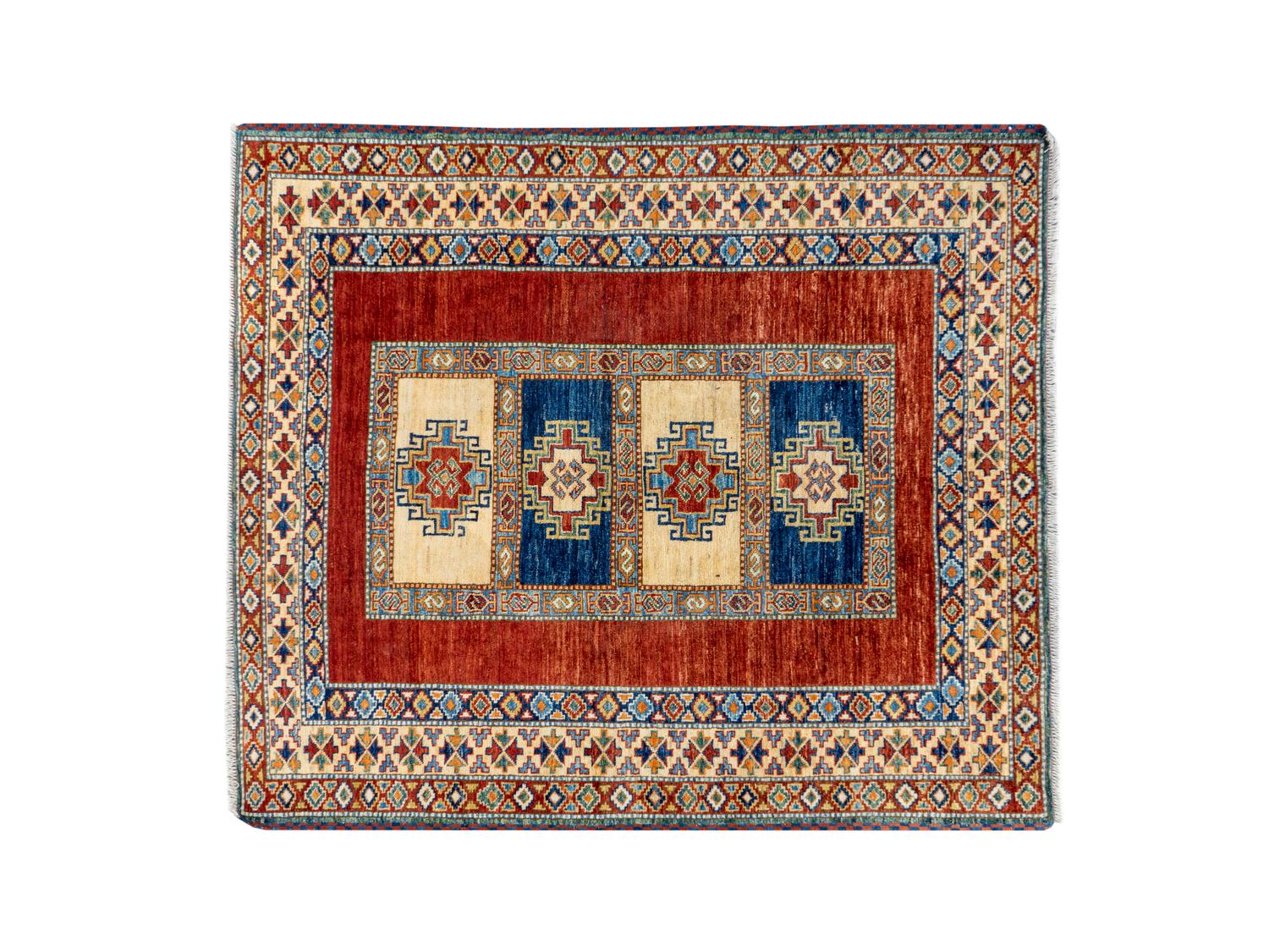 A Caucasian Wool Rug — 20TH CENTURY
