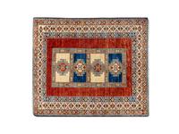 A Caucasian Wool Rug — 20TH CENTURY