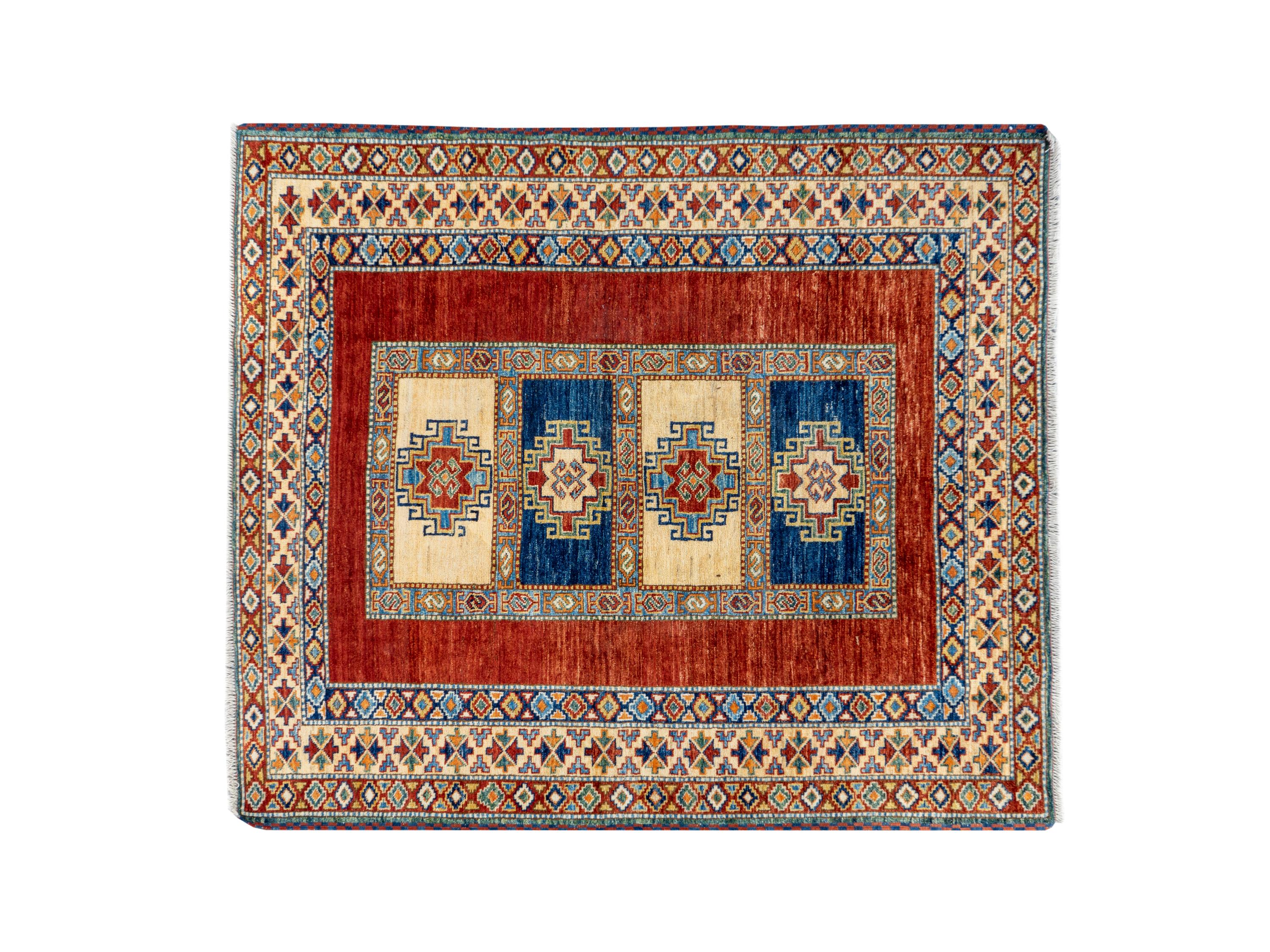 A Caucasian Wool Rug — 20TH CENTURY