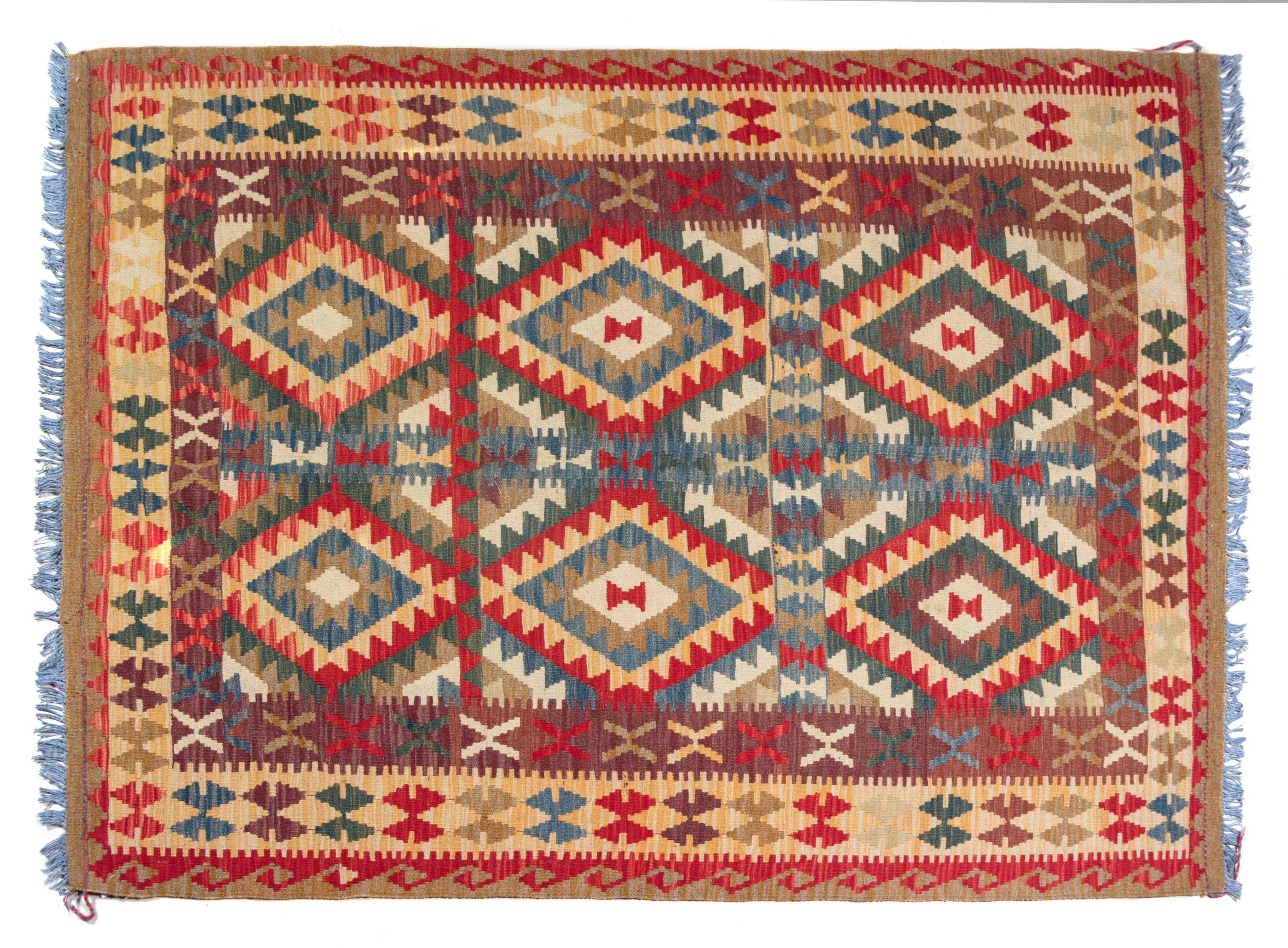 A Kilim Wool Rug 5 feet x 6 feet 6 inches.