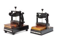 A Pair of Regency Style Ebony and Rosewood Book Presses