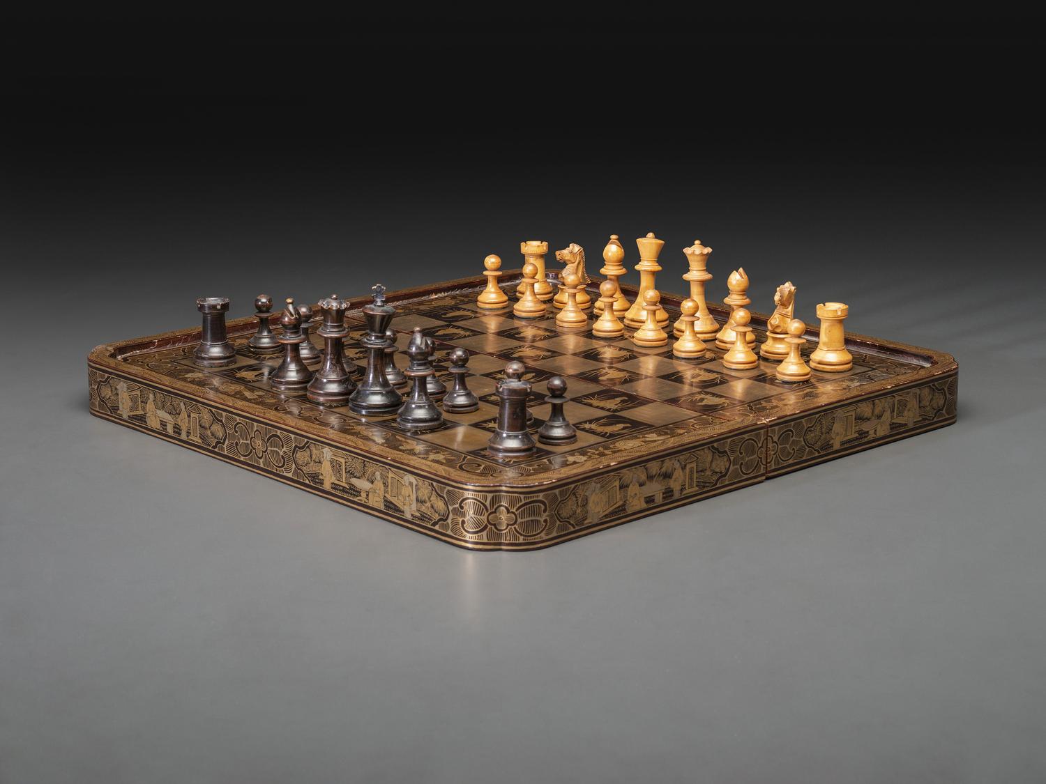 A Chinese Export Gilt Decorated Black Lacquer Folding Game Board