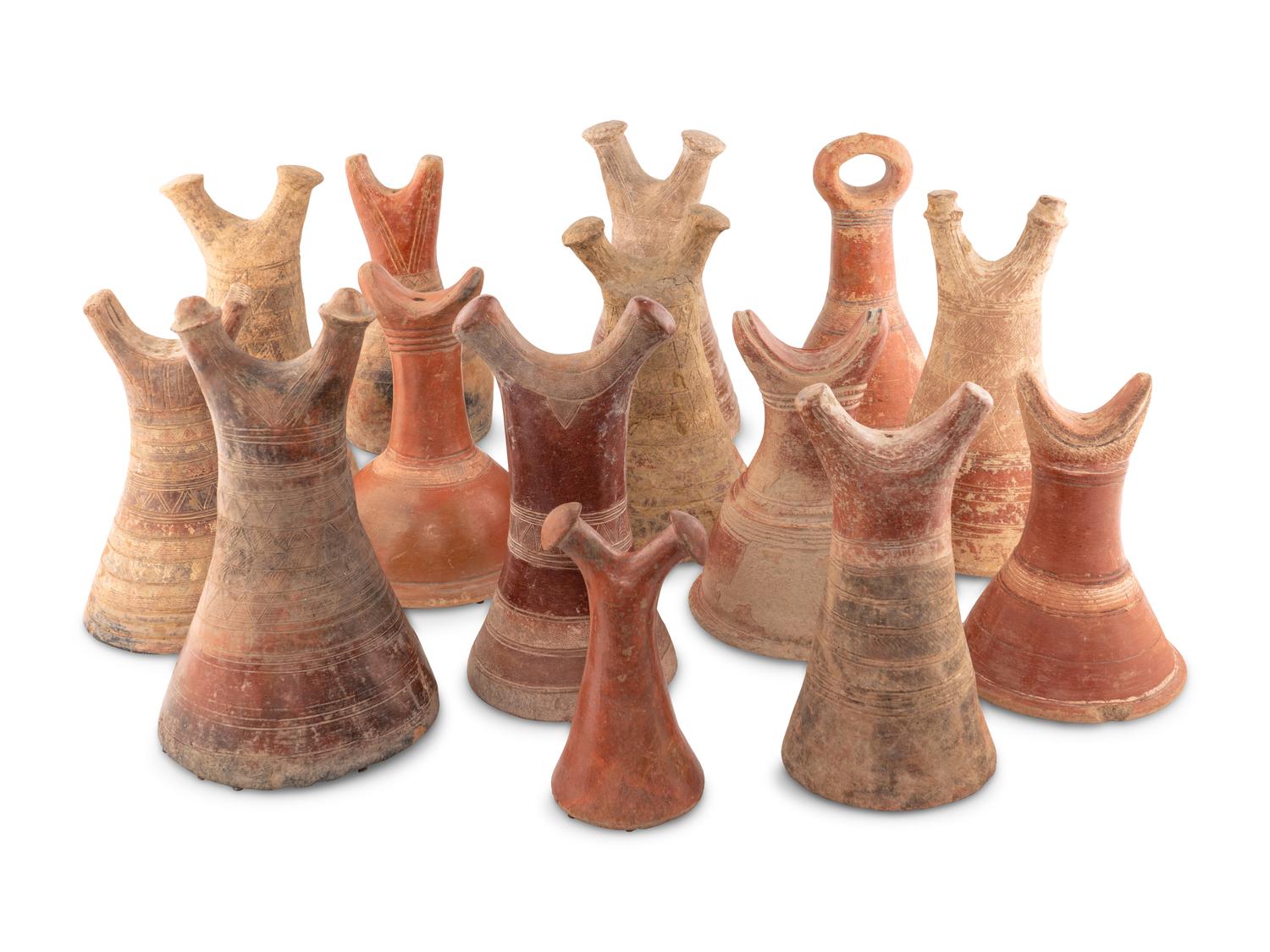 A Collection of Fourteen African Ceramic Headrests