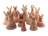 A Collection of Fourteen African Ceramic Headrests
