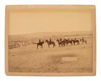 GRABILL, John C.H. (1849-1903), photographer. Photograph of General Nelson Miles and his staff viewing a Lakota camp after Wounded Knee, January 1891.