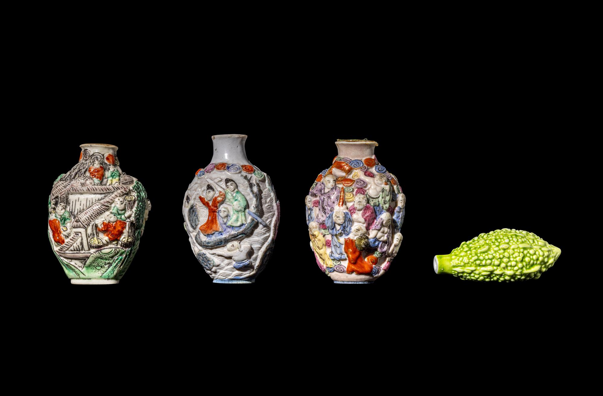 Four Chinese Famille Rose Molded Porcelain Snuff Bottles