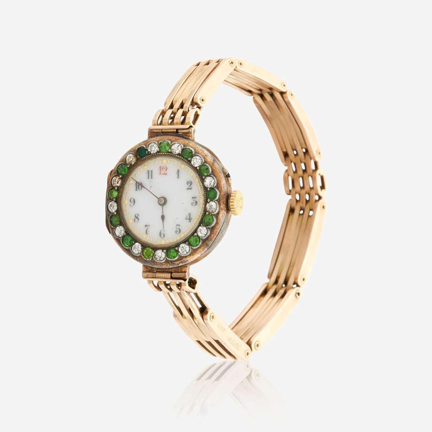 A gold, diamond, and green stone bracelet watch, Swiss C.1909