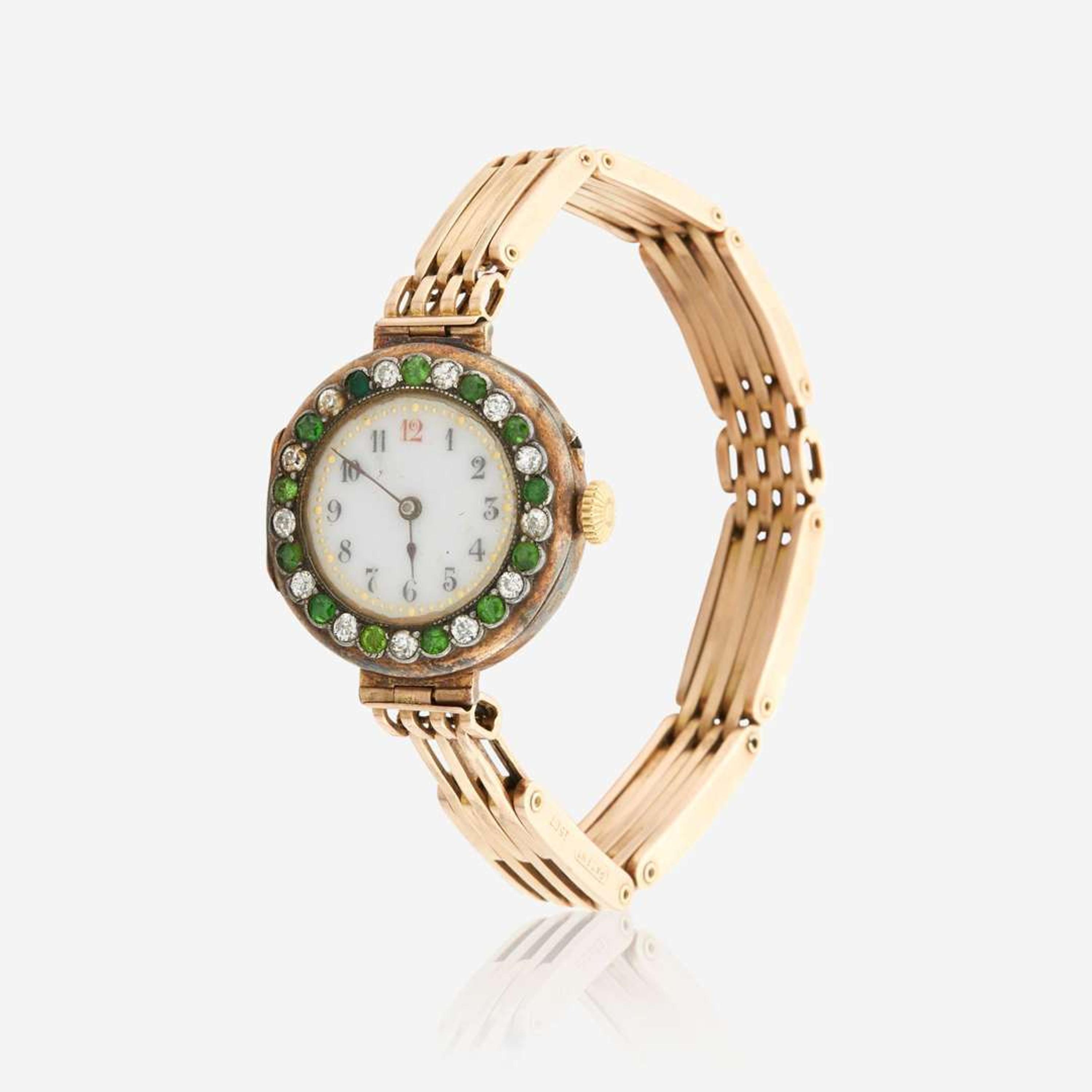 A gold, diamond, and green stone bracelet watch, Swiss C.1909