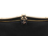 A Judith Leiber Black Leather Clutch