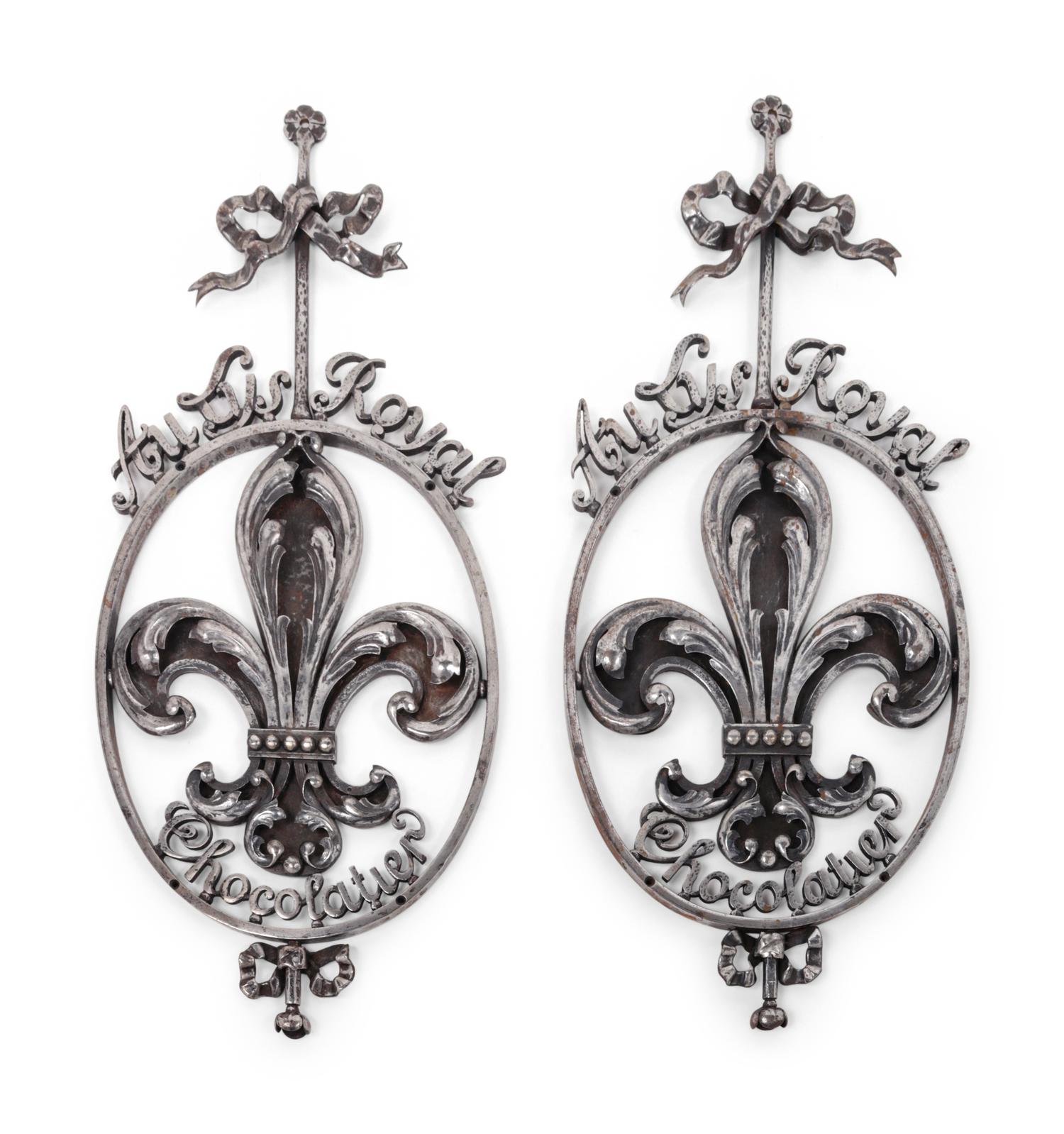 A Pair of French Wrought Iron or Steel Chocolatier's Trade Signs