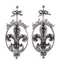 A Pair of French Wrought Iron or Steel Chocolatier's Trade Signs