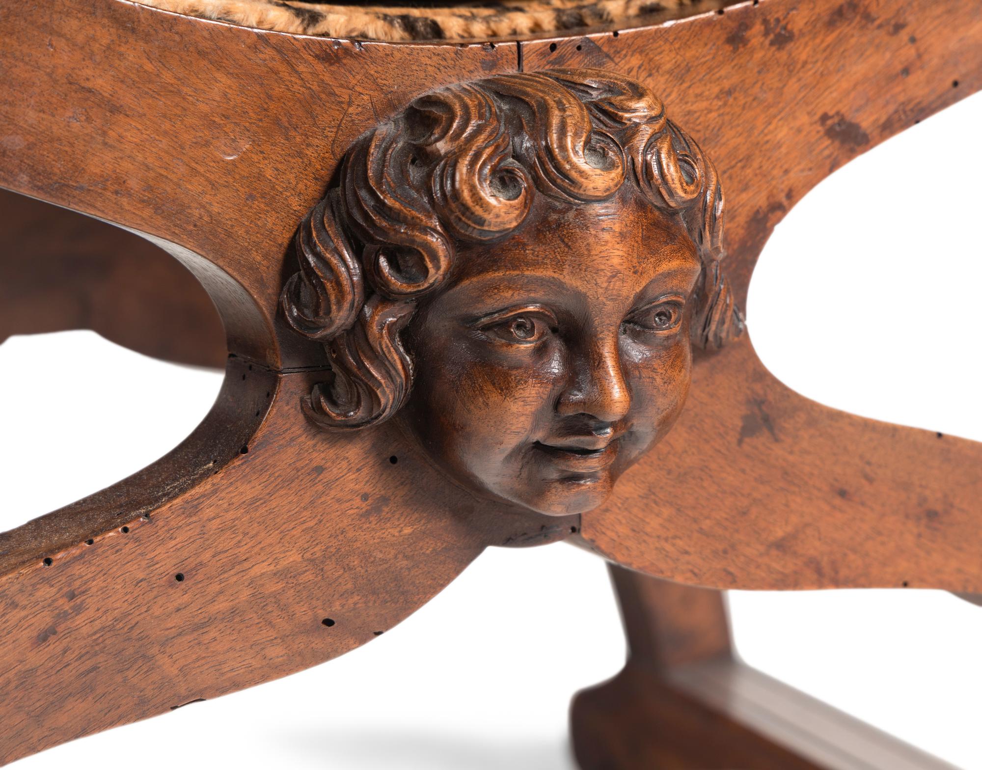 An Italian Baroque Style Walnut Savonarola Chair