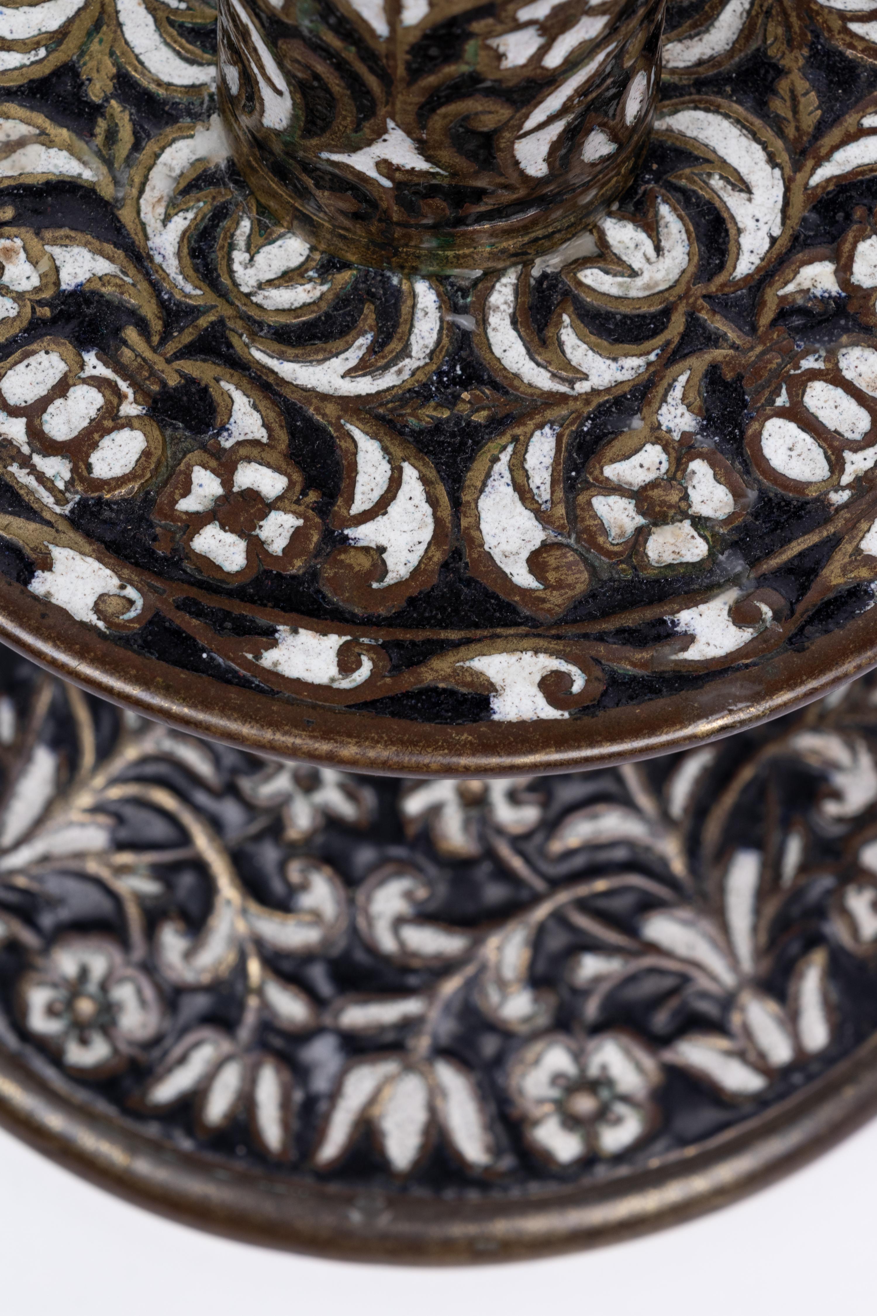 A Pair of Cast Brass 'Surrey Enamel' Candlesticks