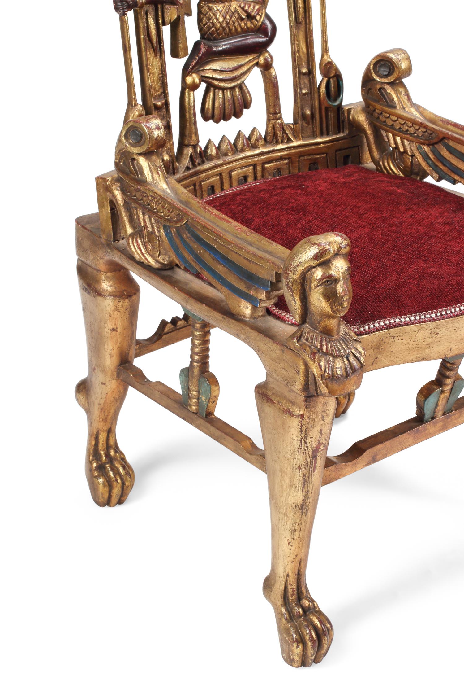 A Pair of Egyptian Style Painted and Parcel-Gilt Armchairs