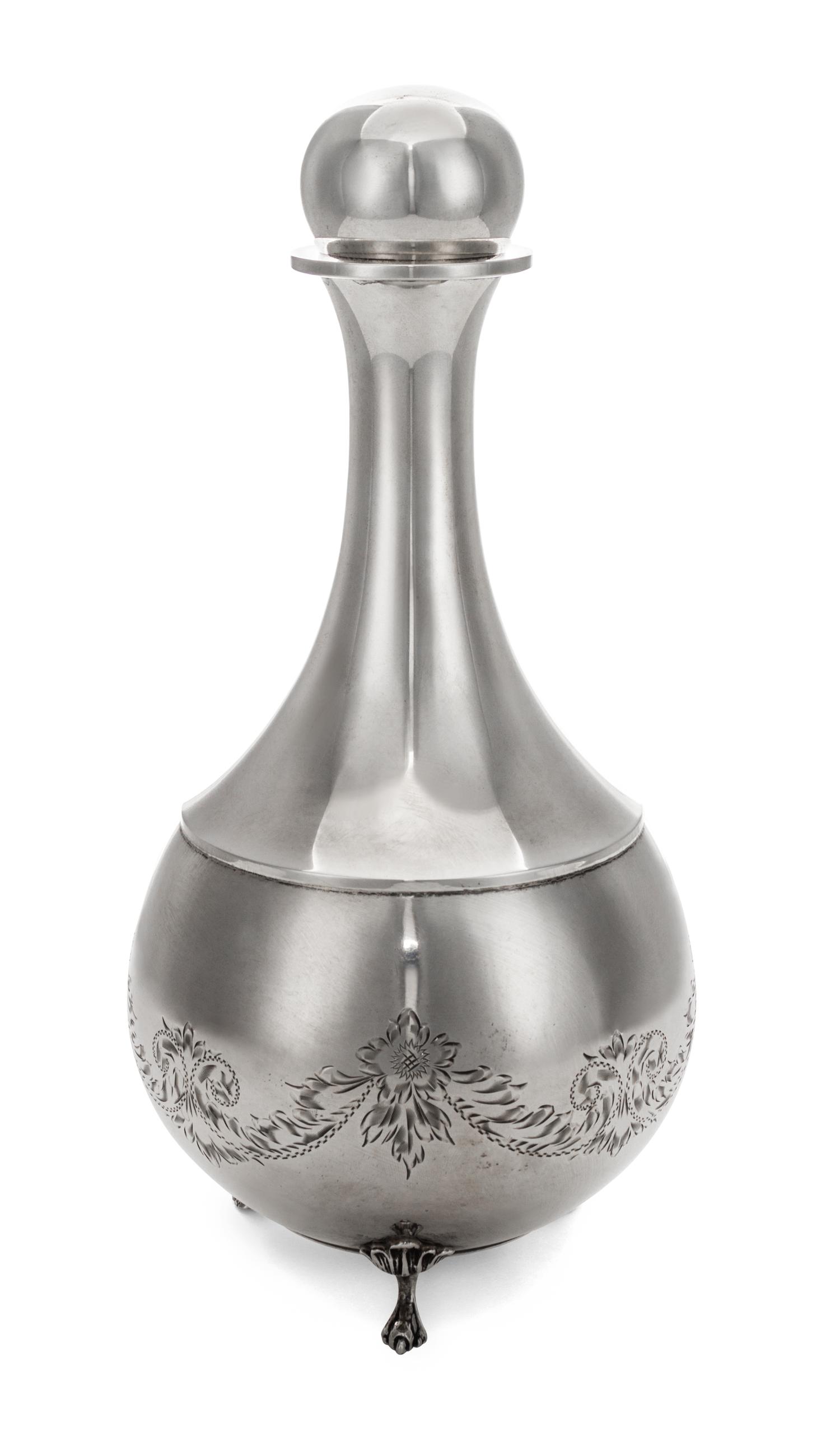 An American Silver Stoppered Bottle, Second Half 20th Century, of baluster footed form with three applied paw feet.