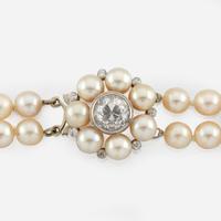 A cultured pearl, diamond, and white gold necklace