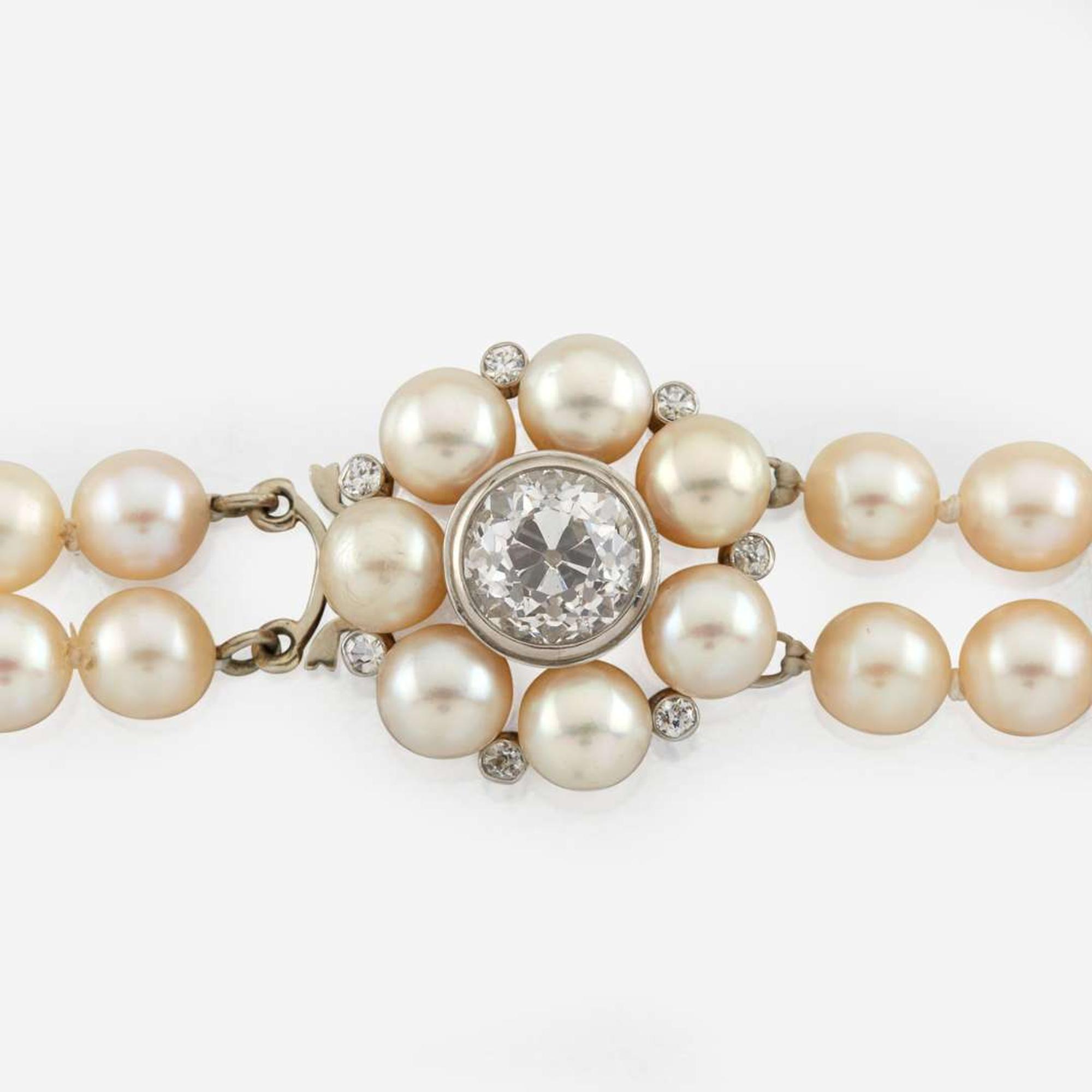 A cultured pearl, diamond, and white gold necklace