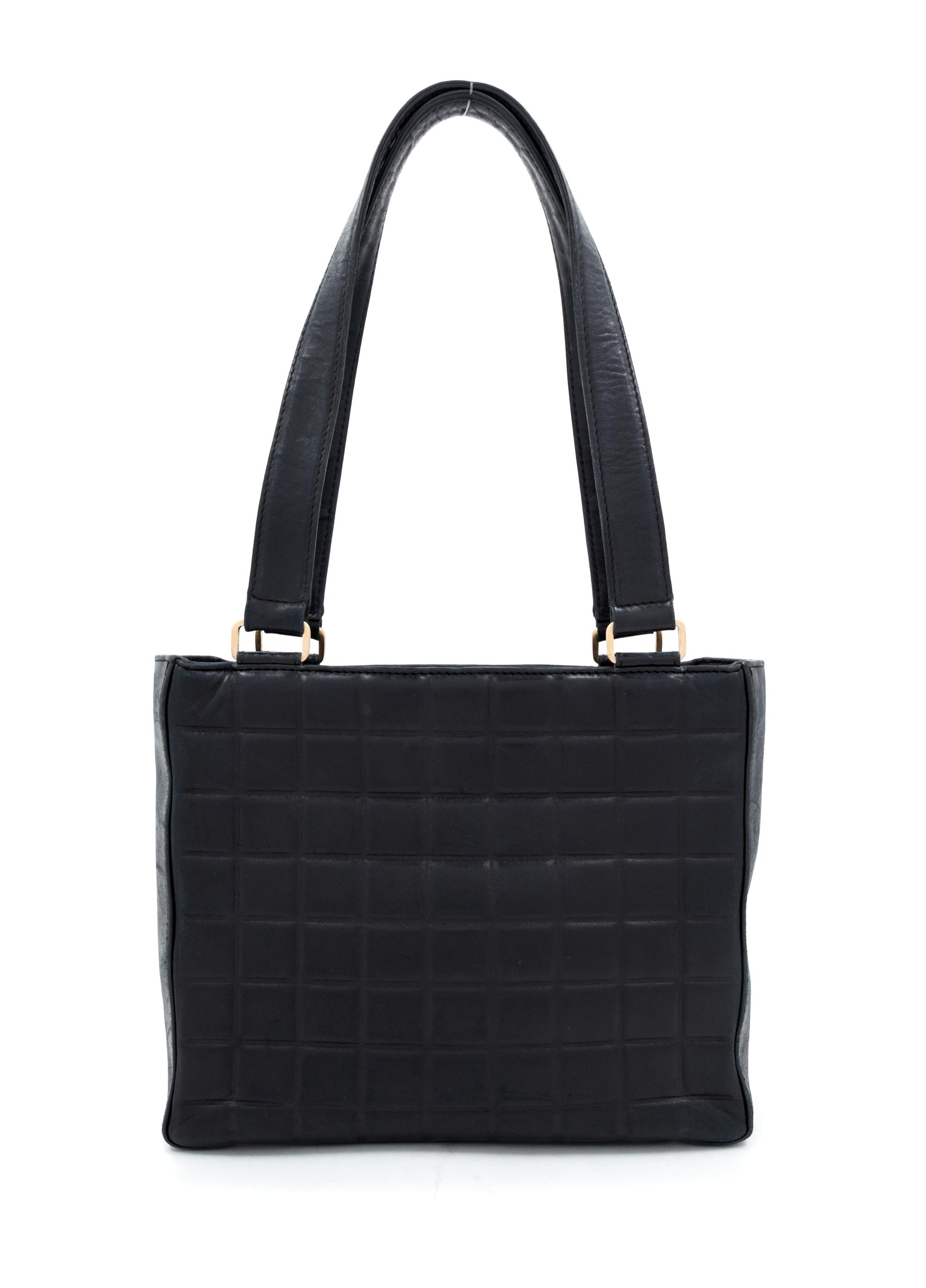 A Chanel Black Lambskin "Chocolate Bar" Tote, 8" H x 10" W x 3.25" D; Strap drop: 9".