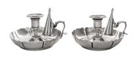 A Pair of Victorian Silver Chambersticks, Richard Sibley I, London, 1842, each having an urn shaped candle cup above a circular base wi