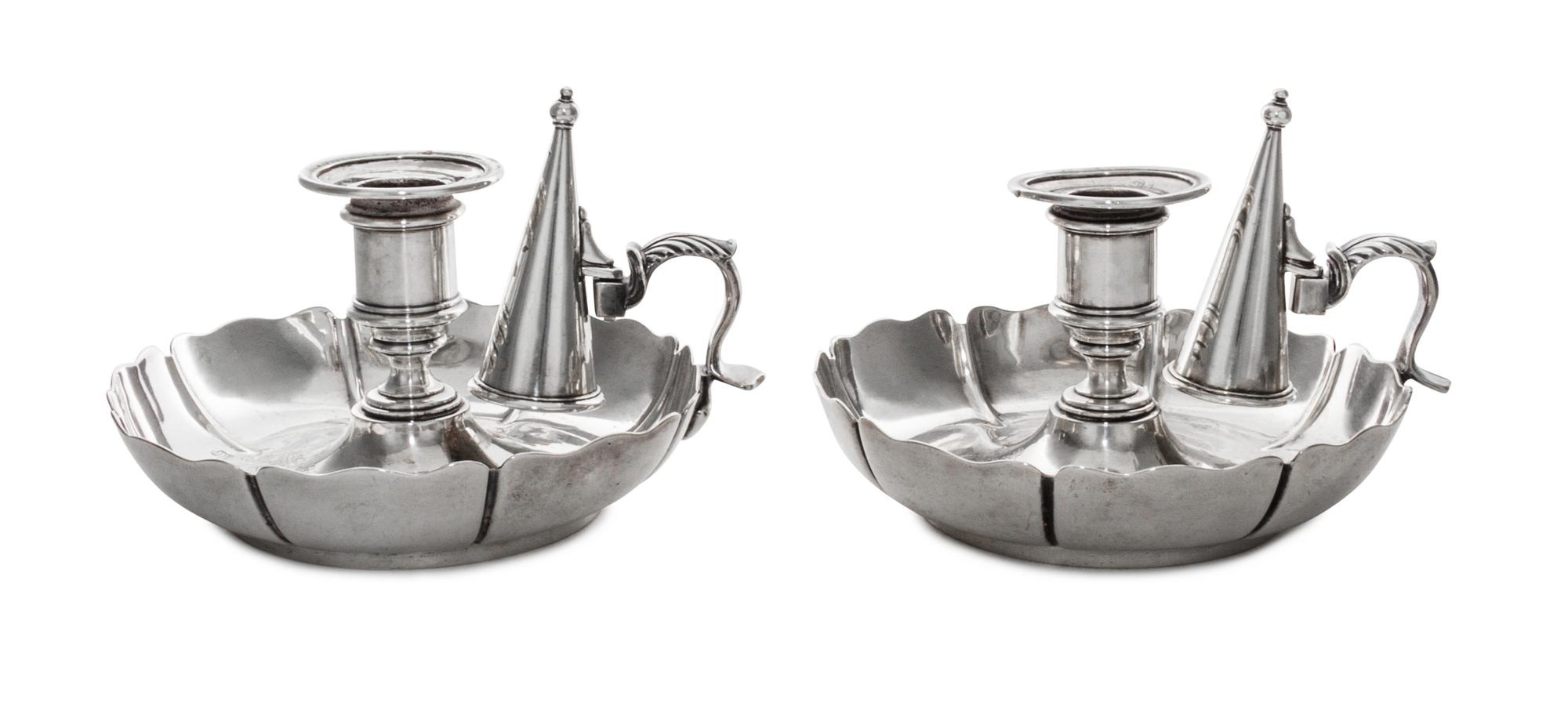 A Pair of Victorian Silver Chambersticks, Richard Sibley I, London, 1842, each having an urn shaped candle cup above a circular base wi
