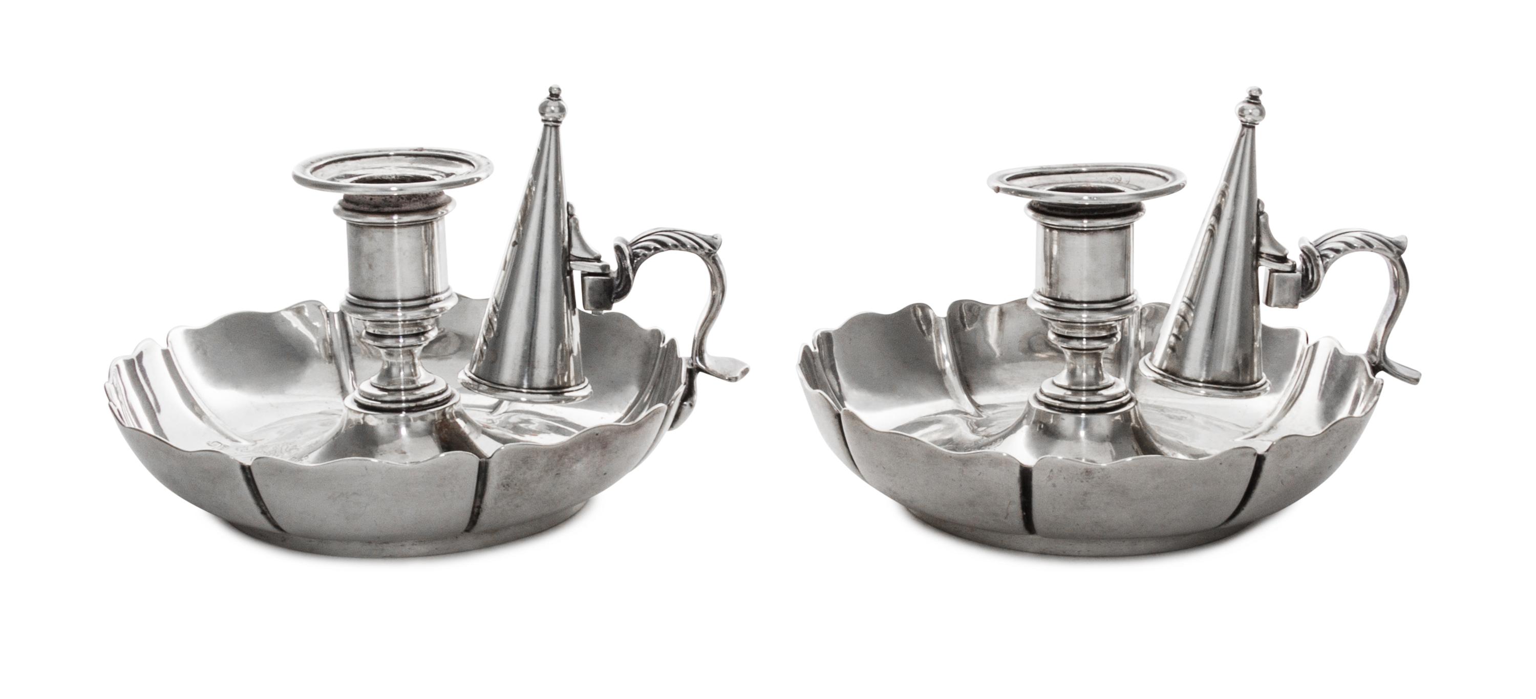 A Pair of Victorian Silver Chambersticks, Richard Sibley I, London, 1842, each having an urn shaped candle cup above a circular base wi