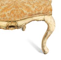 An Italian Painted and Parcel Gilt Settee with Fortuny Upholstery