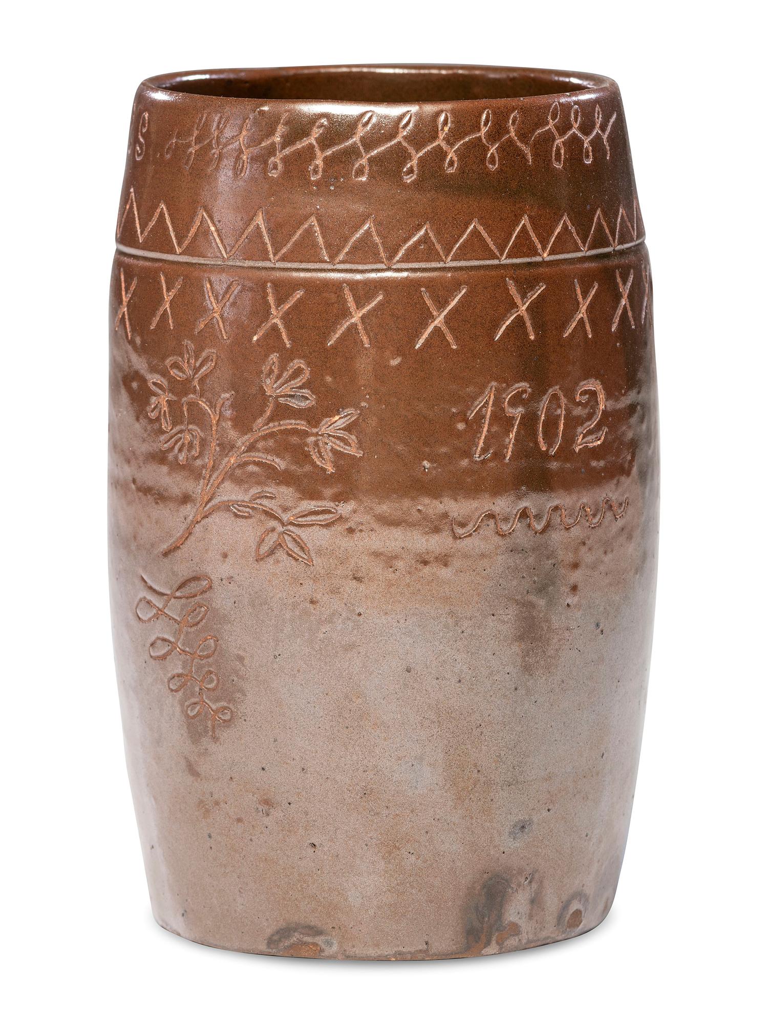A Heavily Incised Albany Slip-Glazed Stoneware Beer Mug
