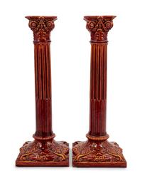 A Pair of English Bermantofts Red-Glazed Faïence Column-Form Candlesticks