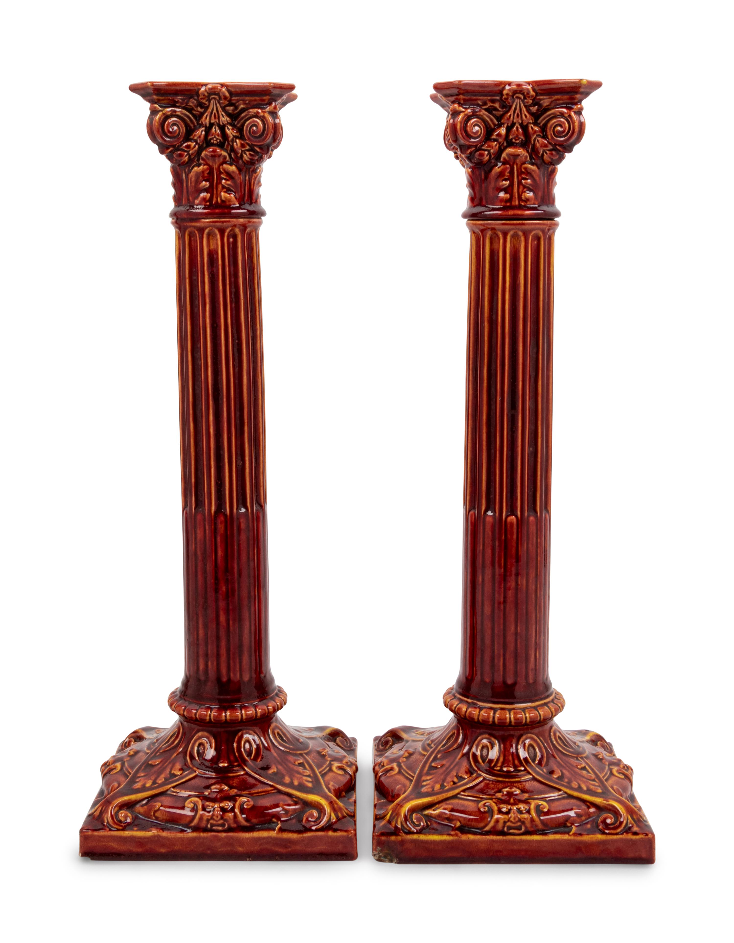 A Pair of English Bermantofts Red-Glazed Faïence Column-Form Candlesticks