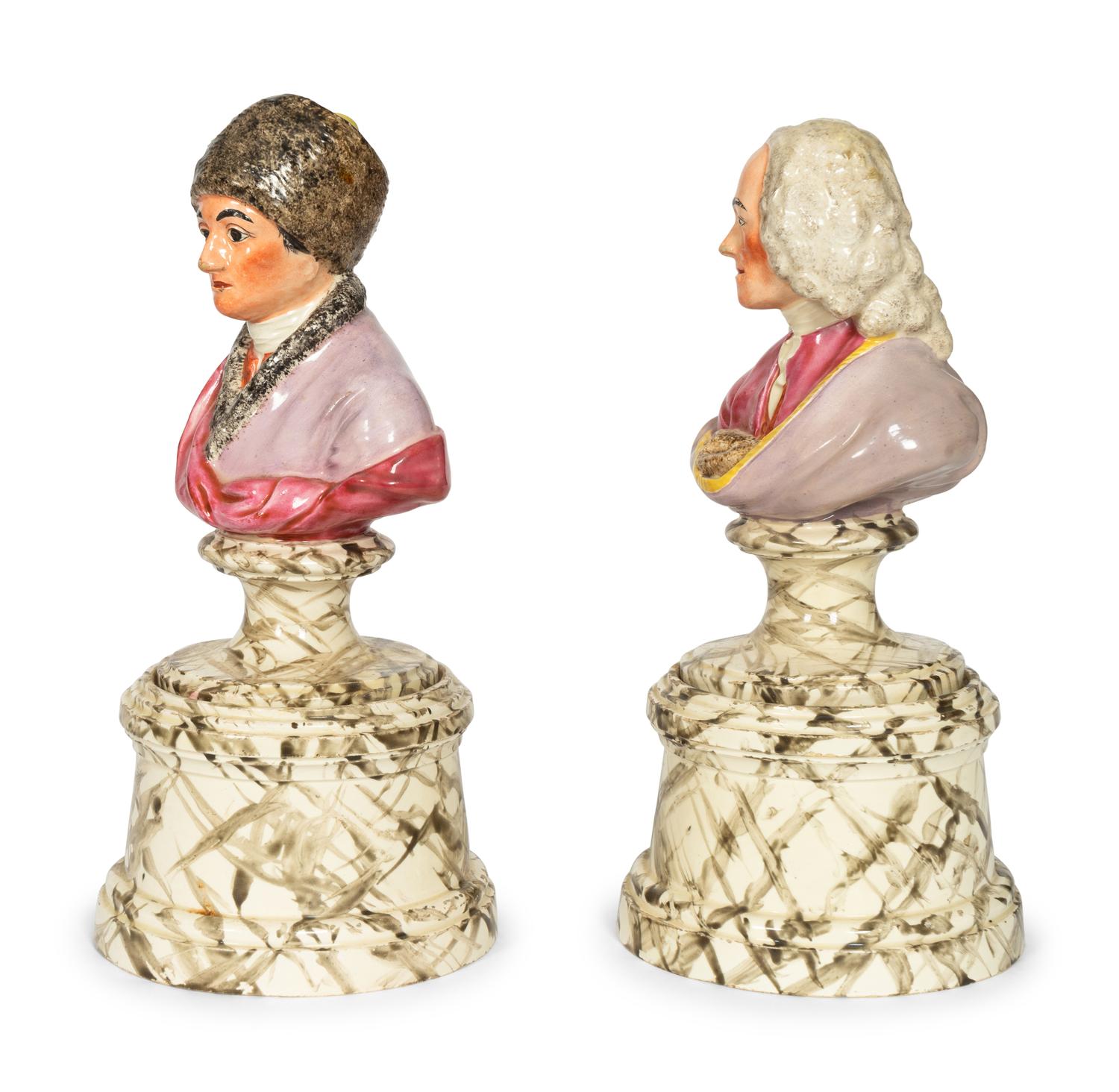 A Pair of French Faience Busts of Voltaire and Rousseau