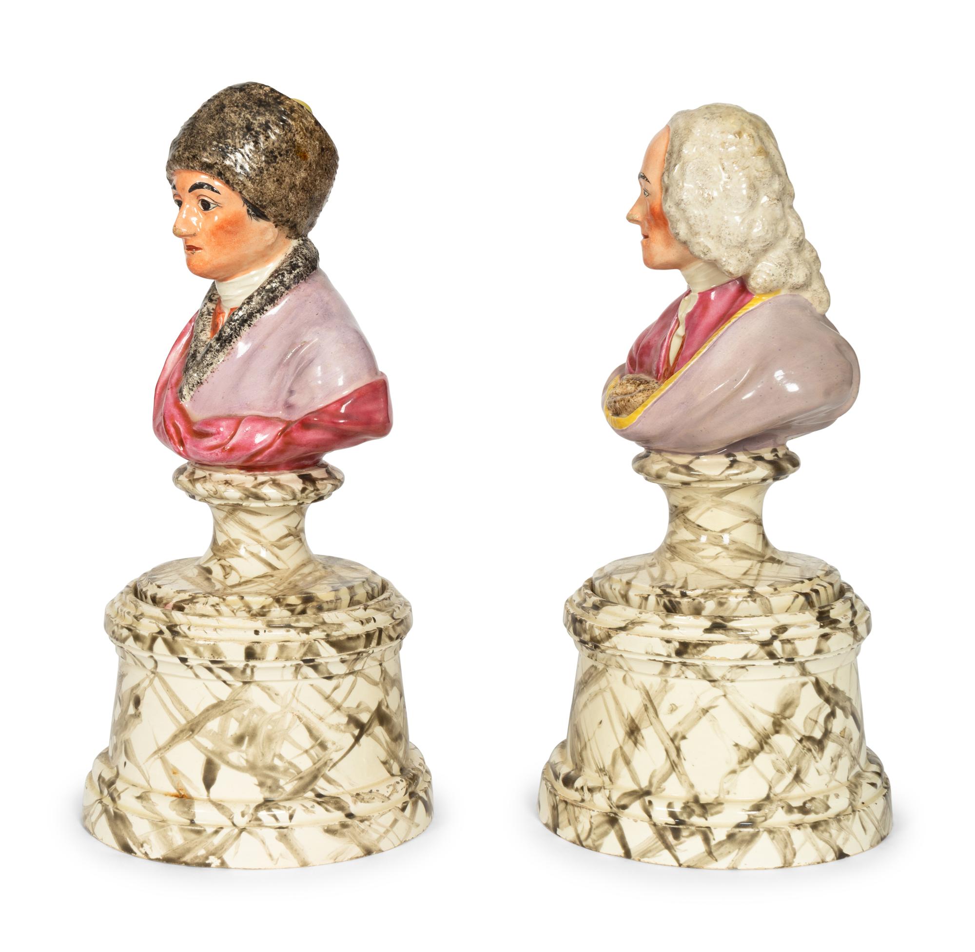 A Pair of French Faience Busts of Voltaire and Rousseau