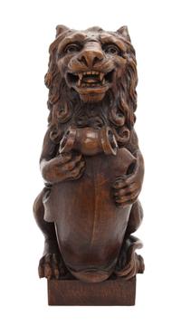 A Carved Walnut Newel Post Figure, Height 15 1/2 inches.