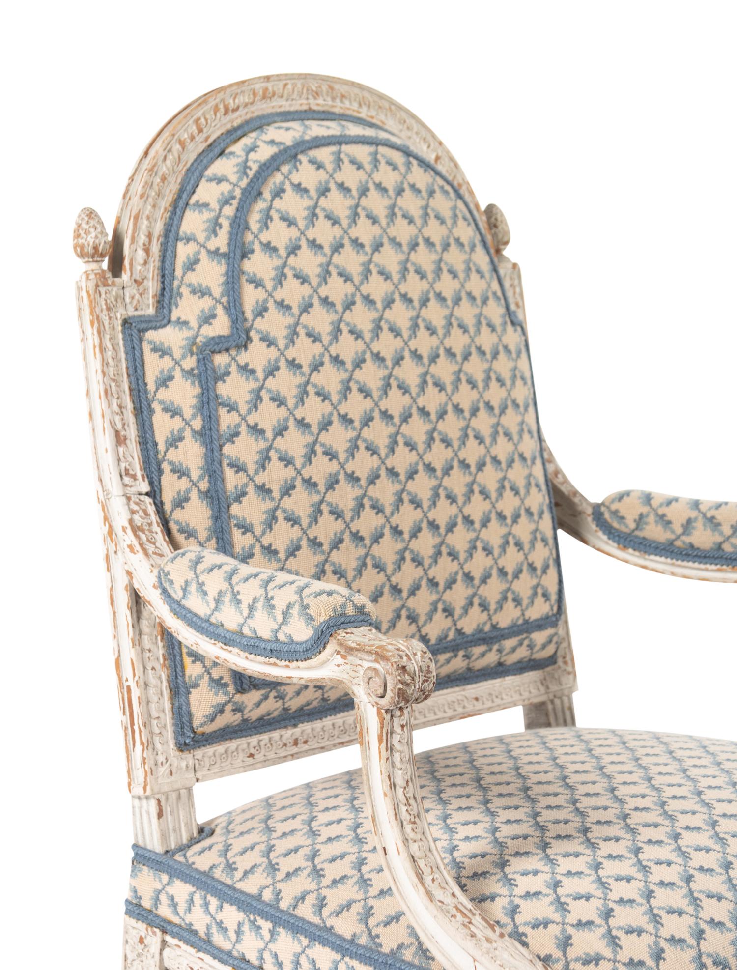 A Pair of Louis XVI Provincial White-Painted Fauteuils