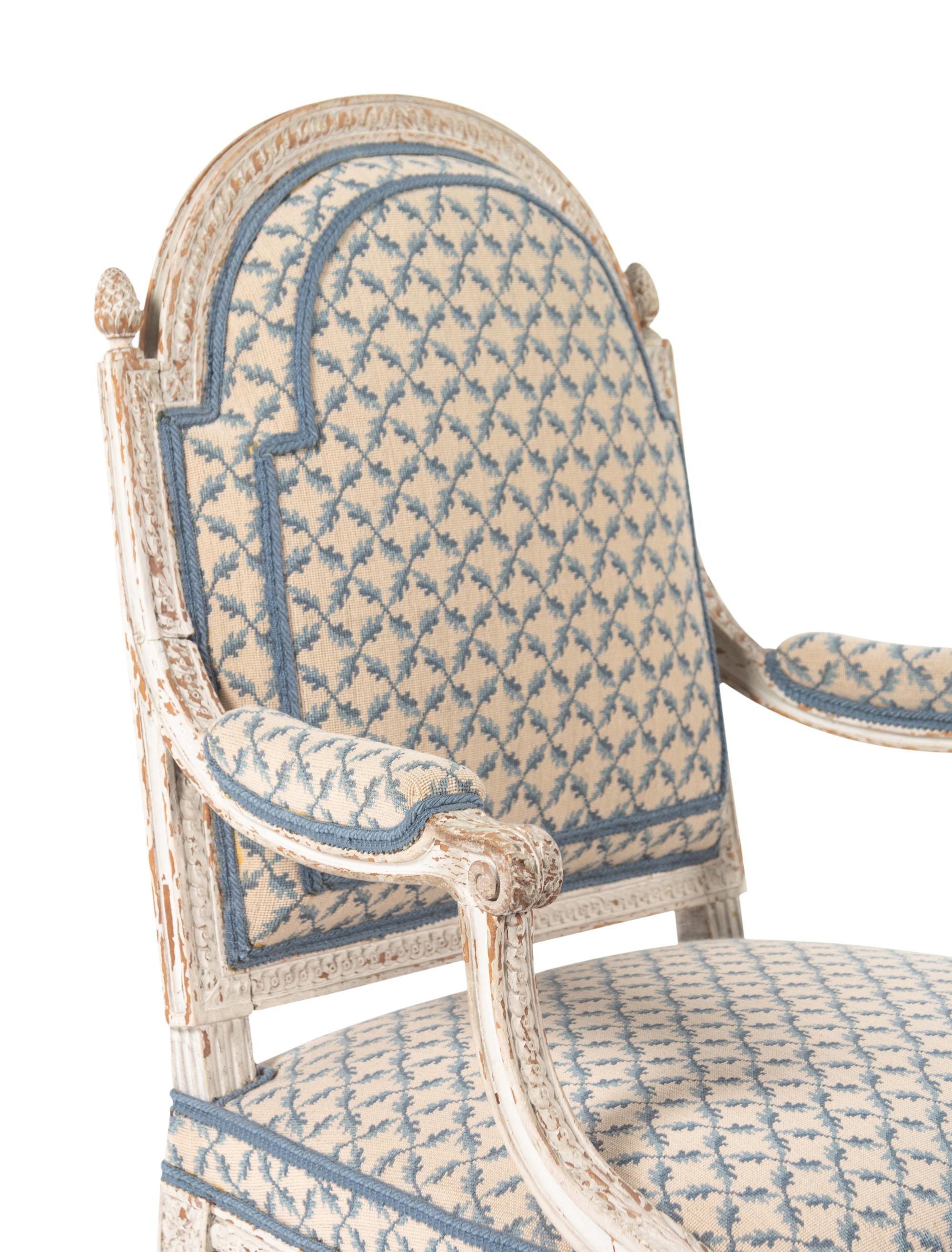 A Pair of Louis XVI Provincial White-Painted Fauteuils