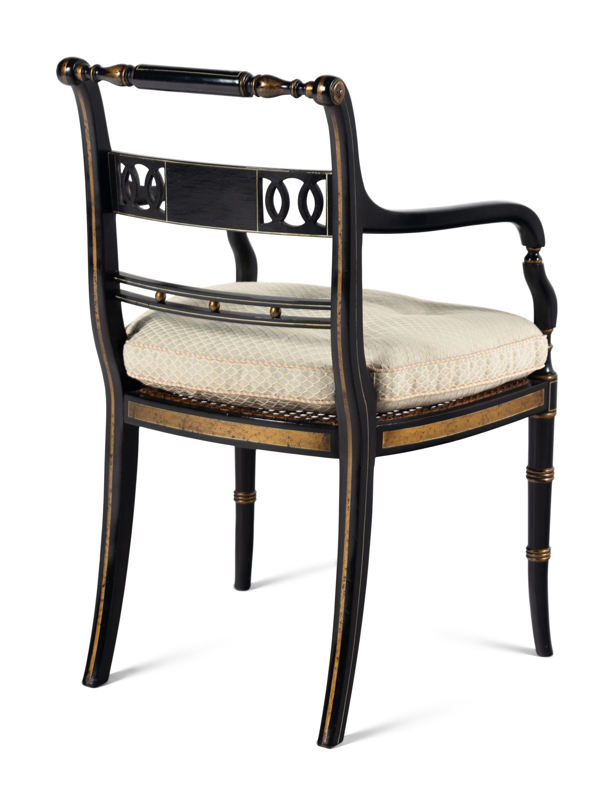 A Set of Four Regency Style Painted and Parcel Gilt Armchairs