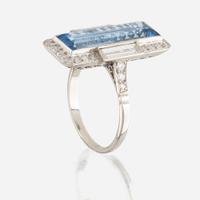 An aquamarine, diamond, and platinum ring
