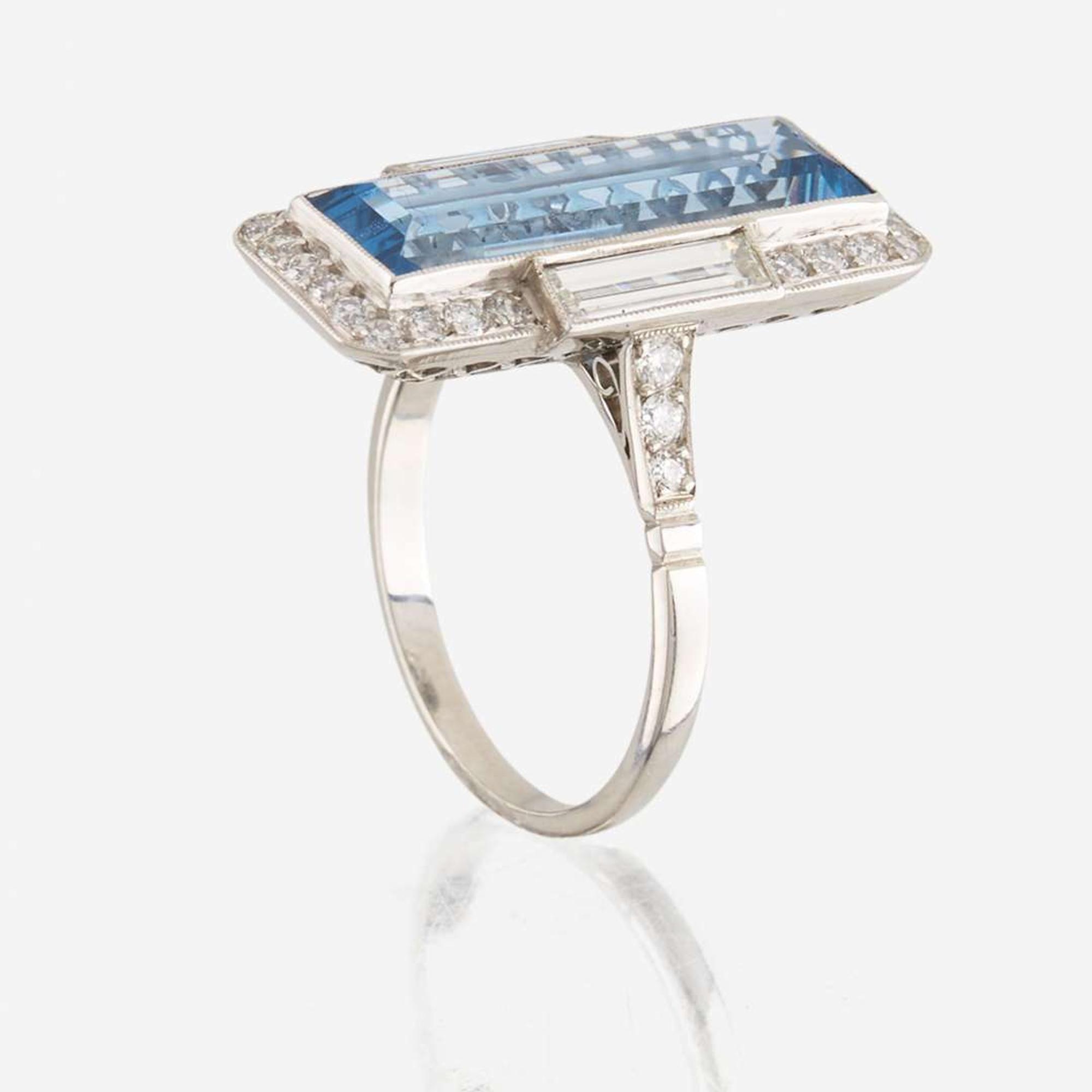 An aquamarine, diamond, and platinum ring