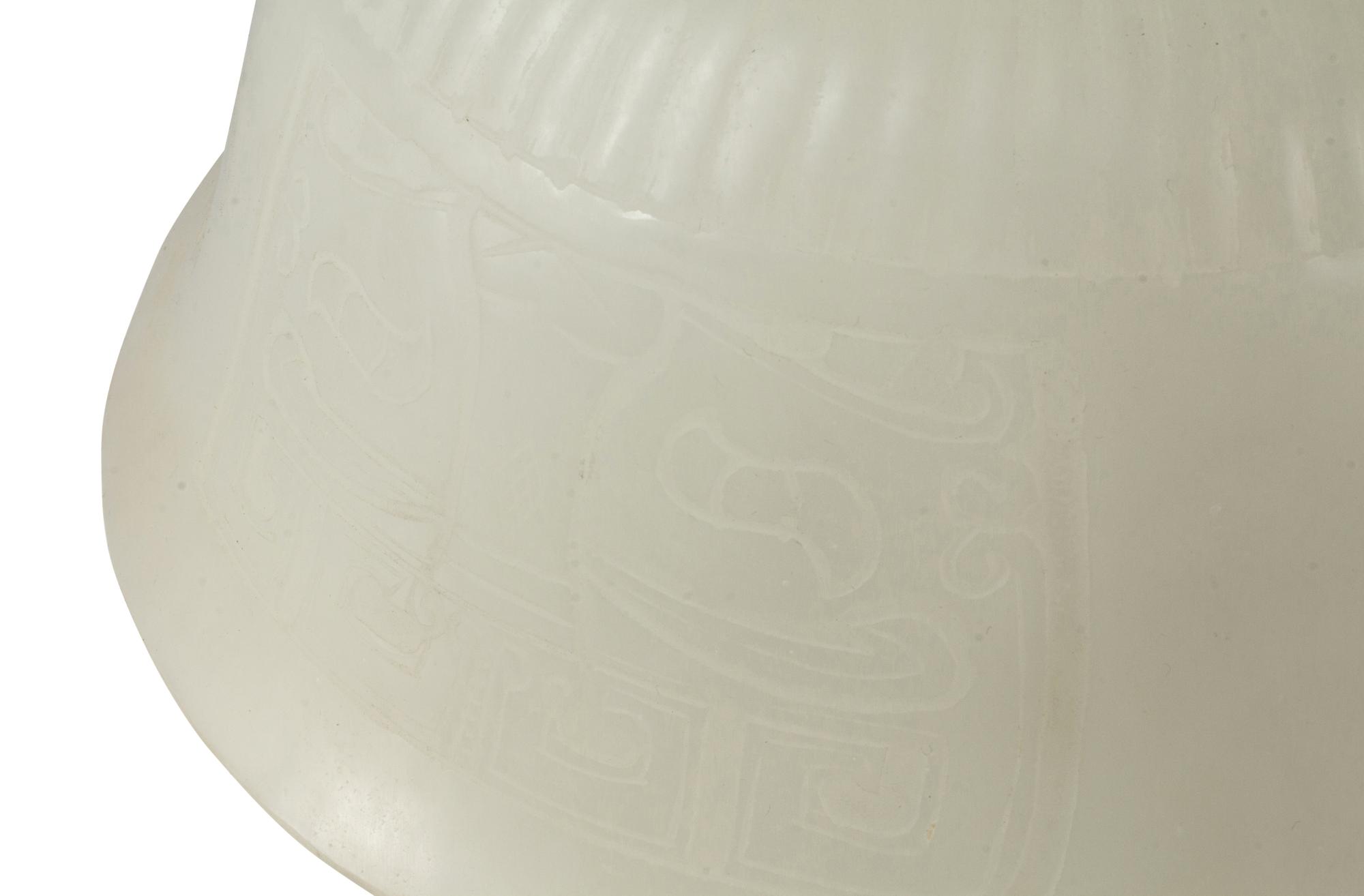 A Pair of Peking Style Carved White Glass Bowls with Wood Stands