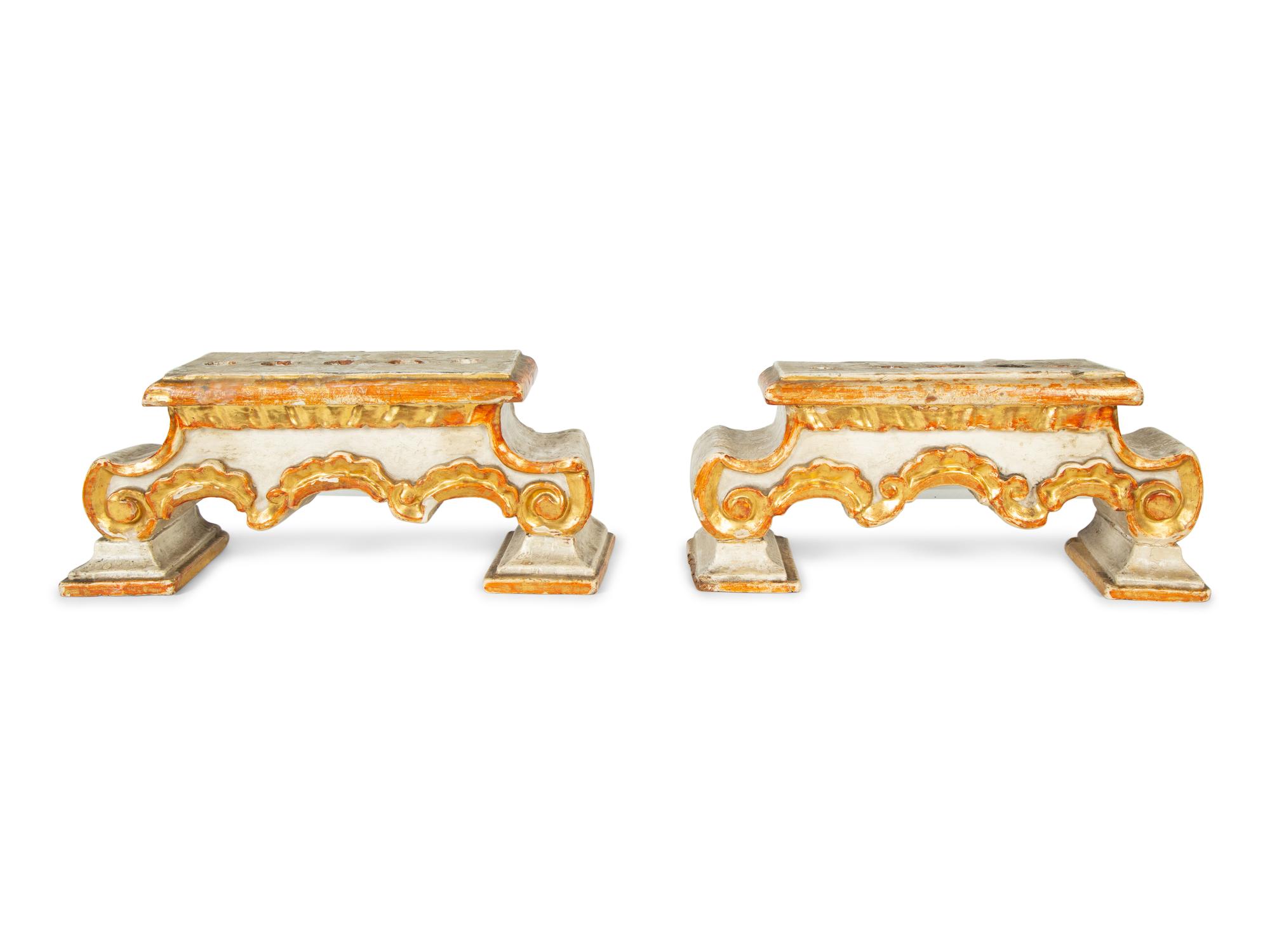 A Pair of Continental Painted and Parcel Gilt Candelabra