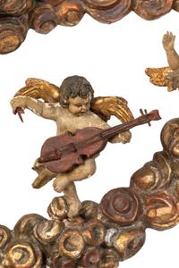 A Florentine Carved Giltwood and Silvered Wood Altarpiece with Musical Putti
