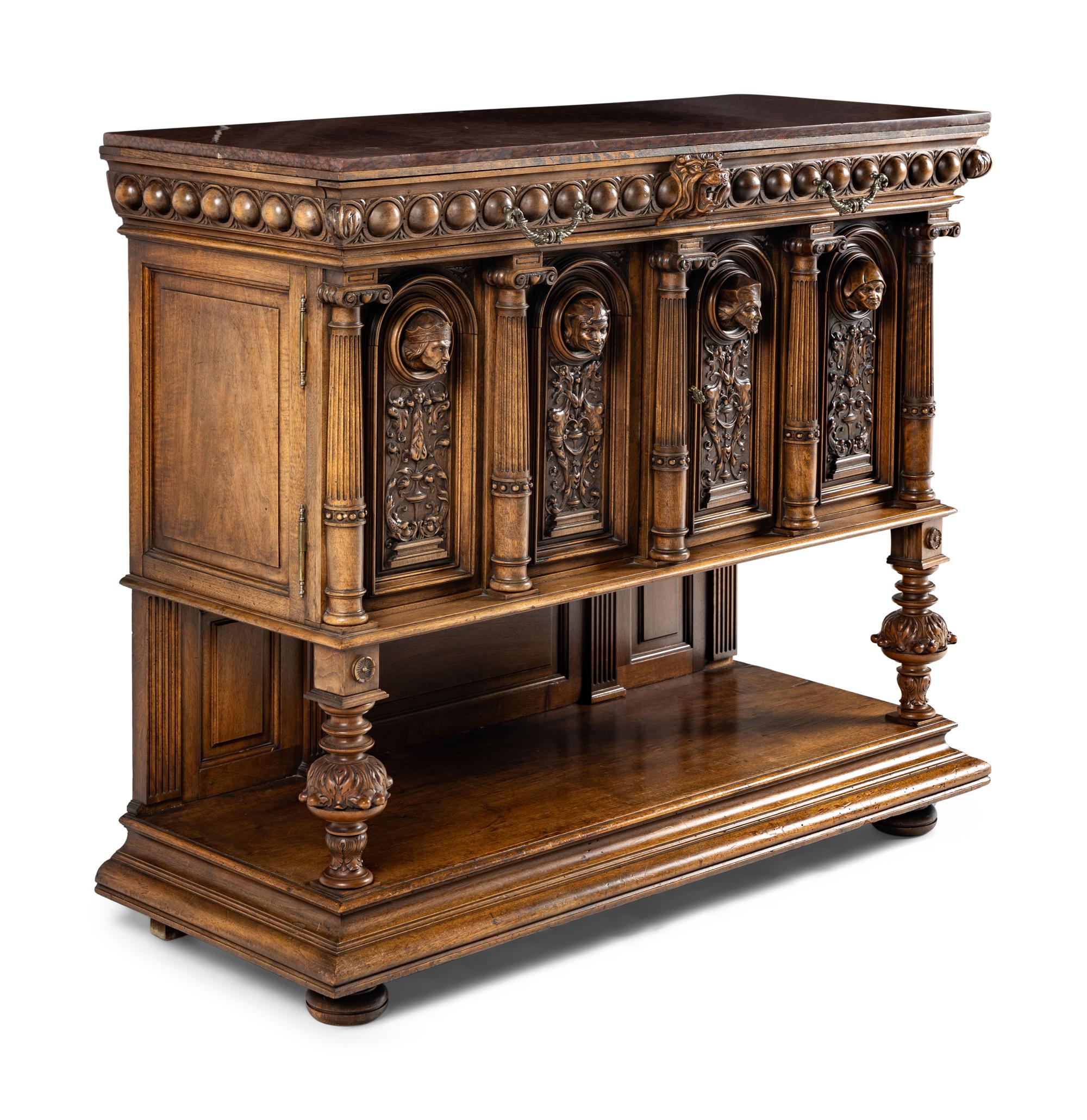 A Renaissance Revival Carved Walnut Marble-Top Cabinet