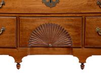 A Queen Anne Carved Walnut Bonnet-Top High Chest of Drawers