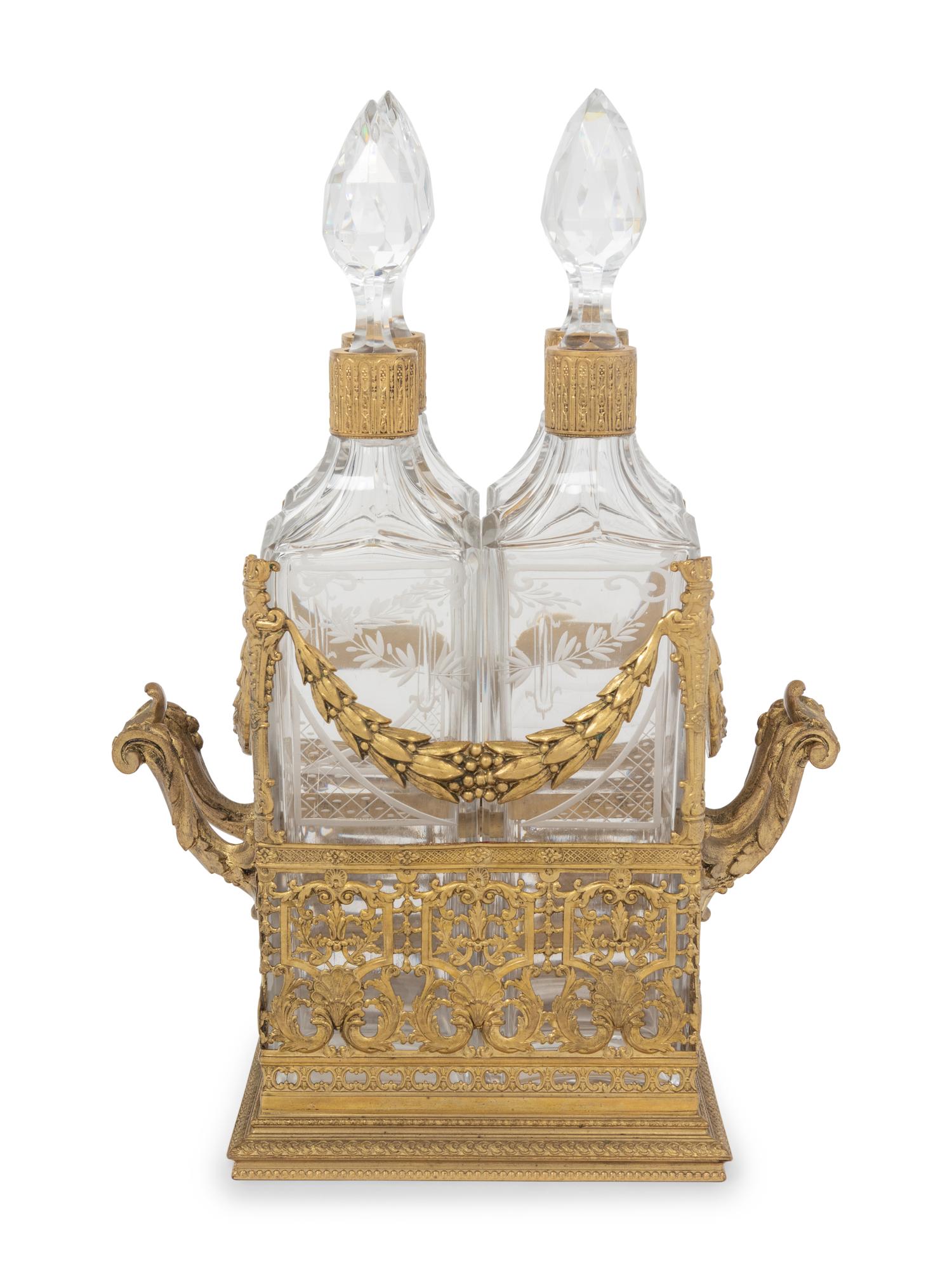 A French Gilt Metal and Glass Four-Bottle Decanter Caddy