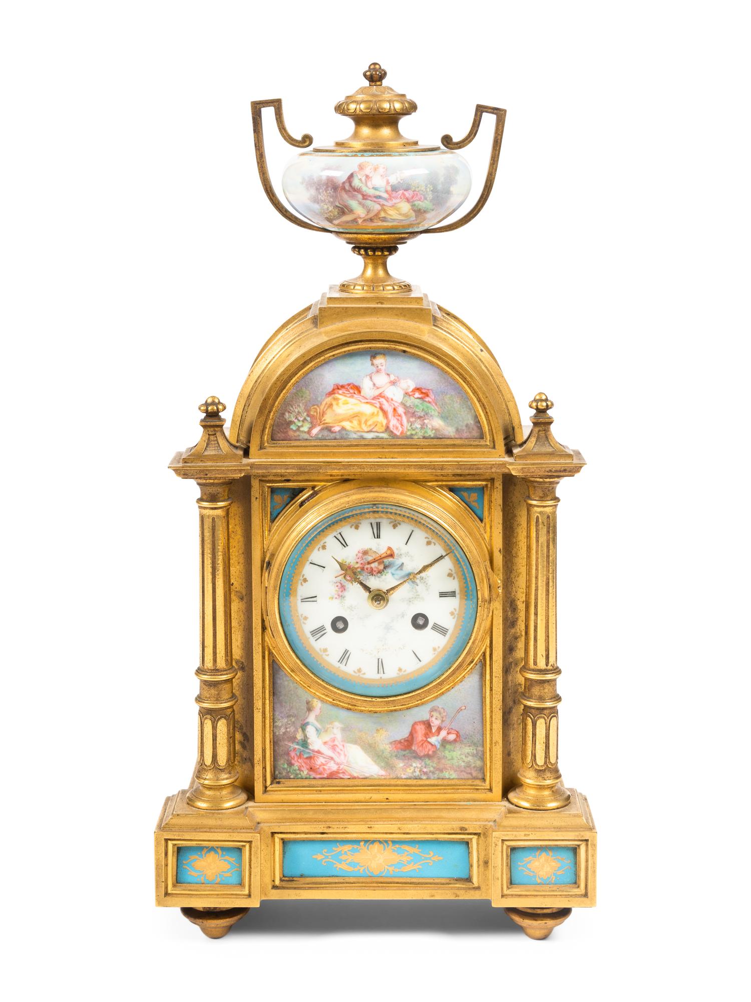 A Louis XVI Style Porcelain Mounted Gilt Bronze Mantel Clock
