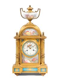 A Louis XVI Style Porcelain Mounted Gilt Bronze Mantel Clock
