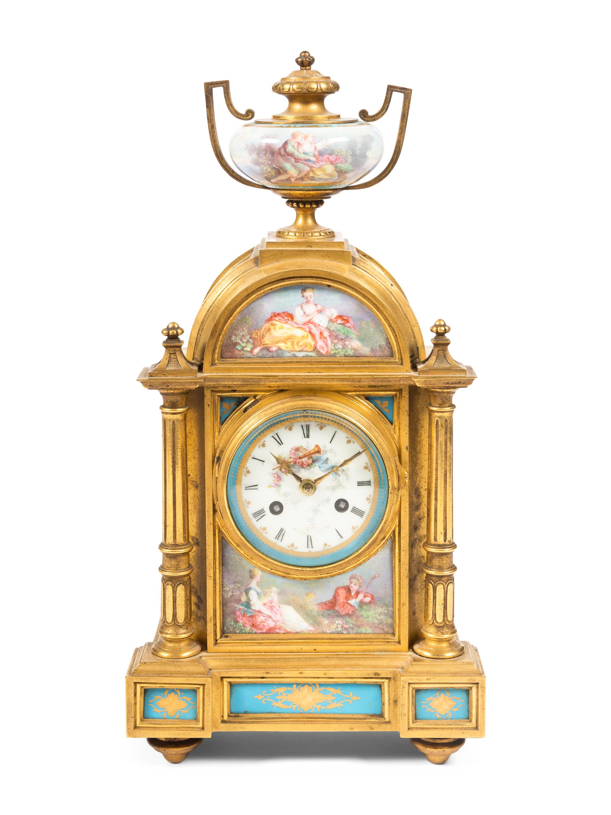 A Louis XVI Style Porcelain Mounted Gilt Bronze Mantel Clock