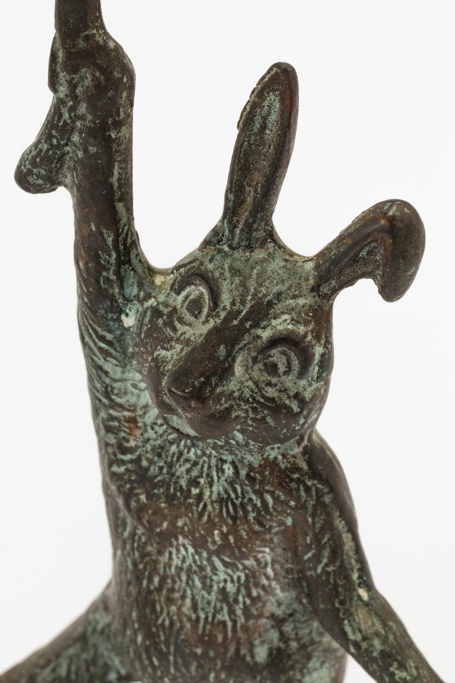 A Pair of Patinated Cast Metal Rabbit Candlesticks