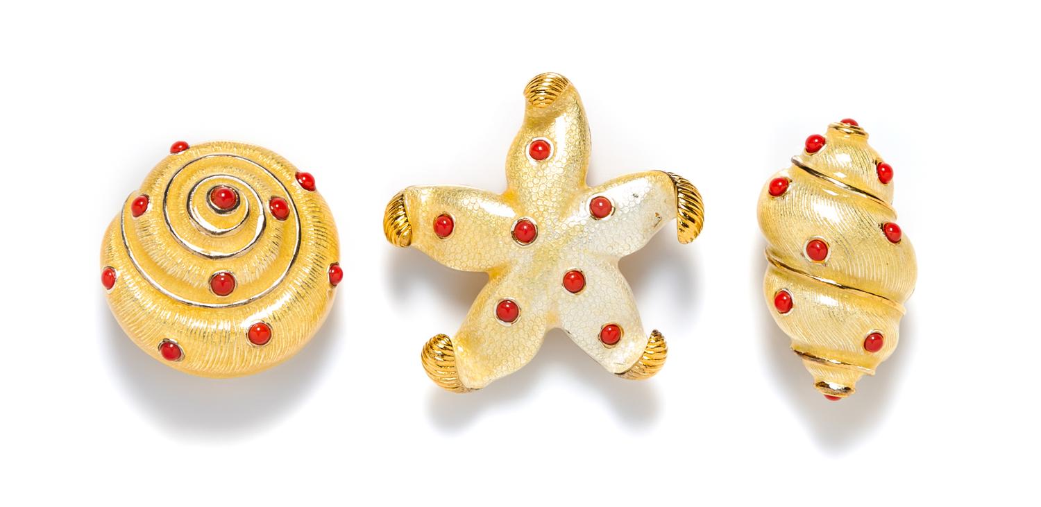 A Group of Carolee Goldtone Starfish and Shell Brooches,