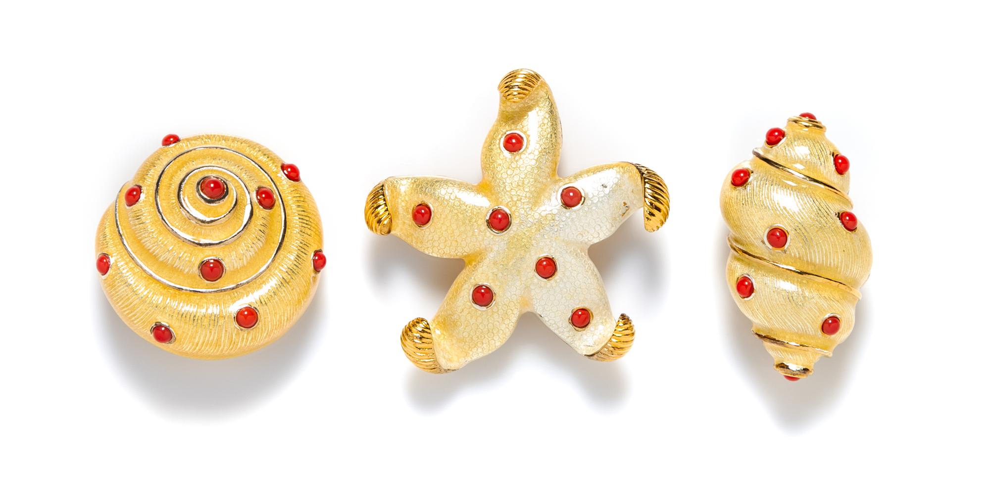 A Group of Carolee Goldtone Starfish and Shell Brooches,