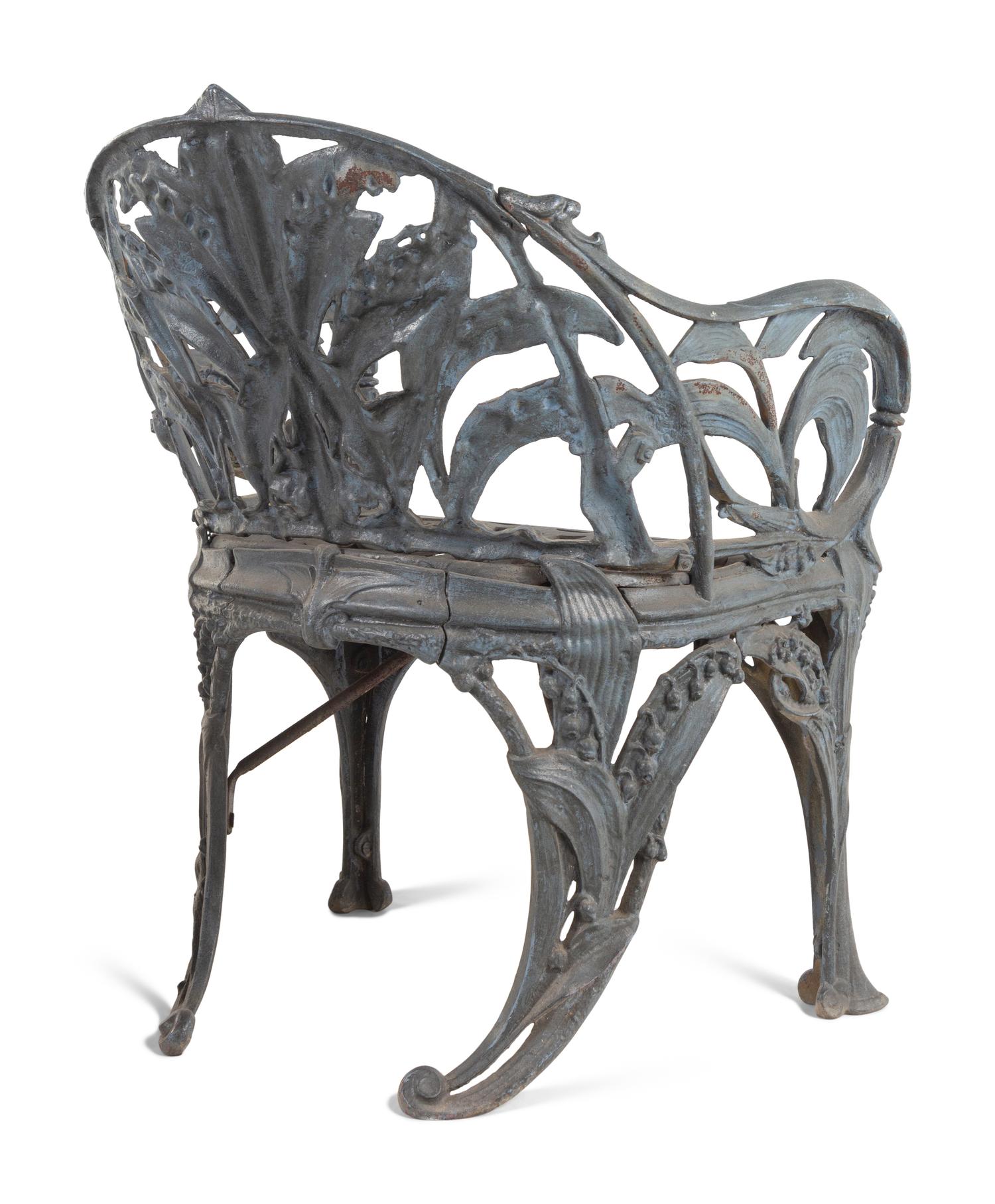 A Set of Four English Cast Iron Garden Chairs